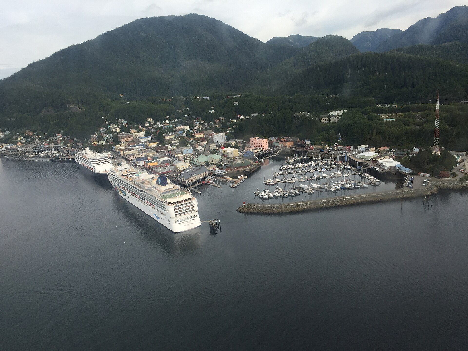A cruise ship docked at Ketchikan, Alaska, below the mountains