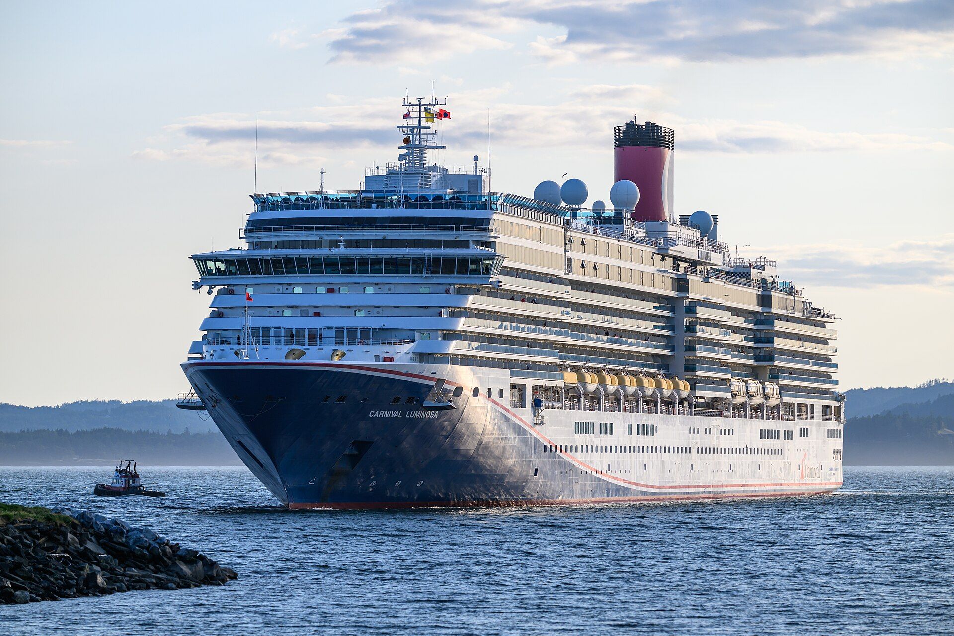 Carnival Luminosa with a tug at Ogden Point, Victoria, British Columbia