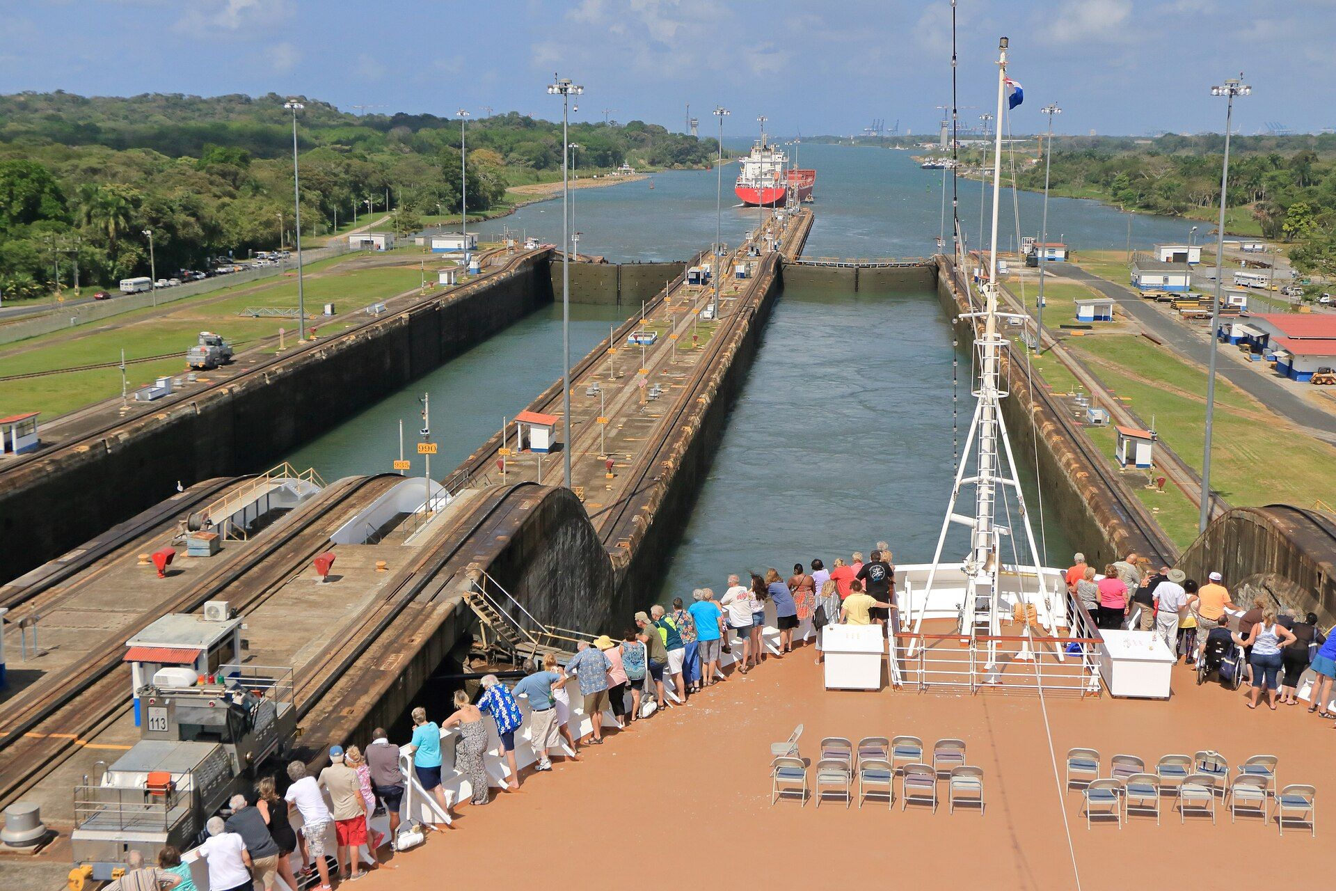 Cruise passengers watching their ship enter a lock on the Panama Canal